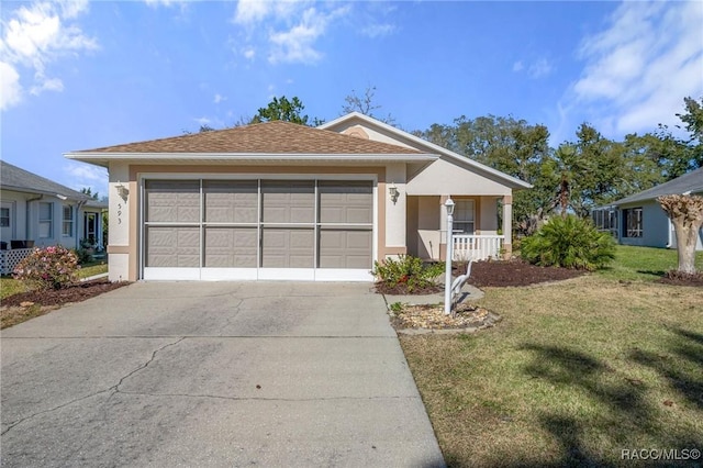 view of front of house featuring a garage, a front yard, and a porch