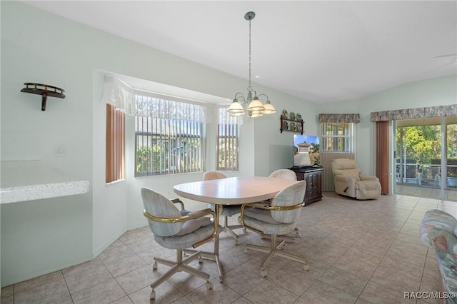 dining room with lofted ceiling, a chandelier, and light tile patterned flooring