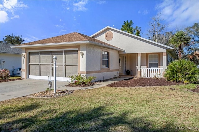 single story home featuring a garage, a front yard, and covered porch