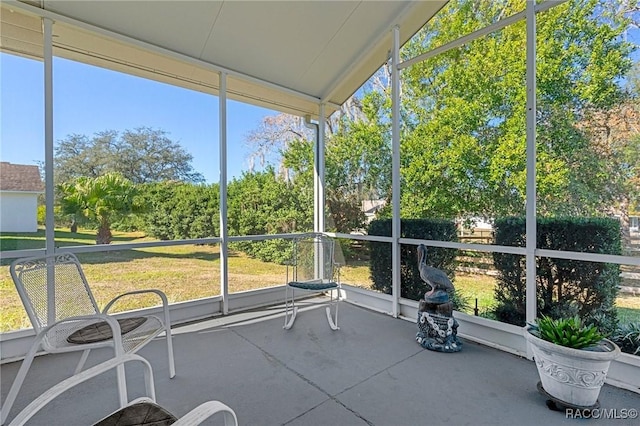 unfurnished sunroom featuring plenty of natural light