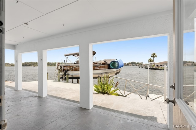 view of patio / terrace with a dock and a water view