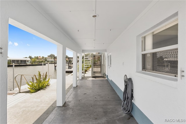 view of patio featuring a water view