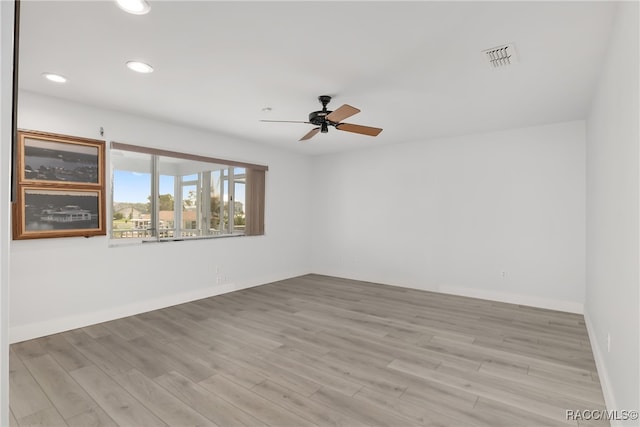 unfurnished room featuring ceiling fan and light hardwood / wood-style flooring