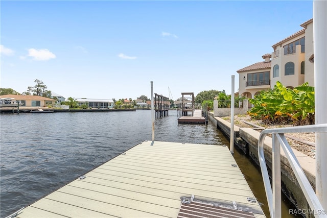 dock area with a water view