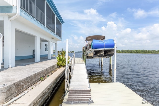 dock area with a water view