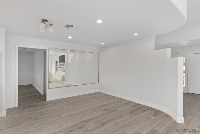 unfurnished room with light hardwood / wood-style flooring