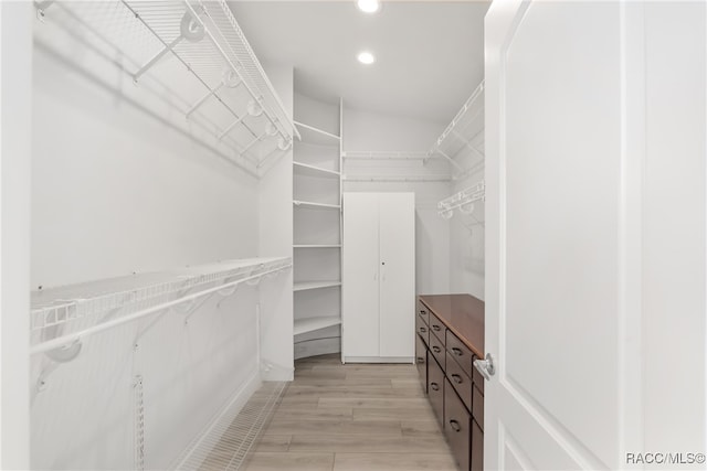 walk in closet featuring light wood-type flooring