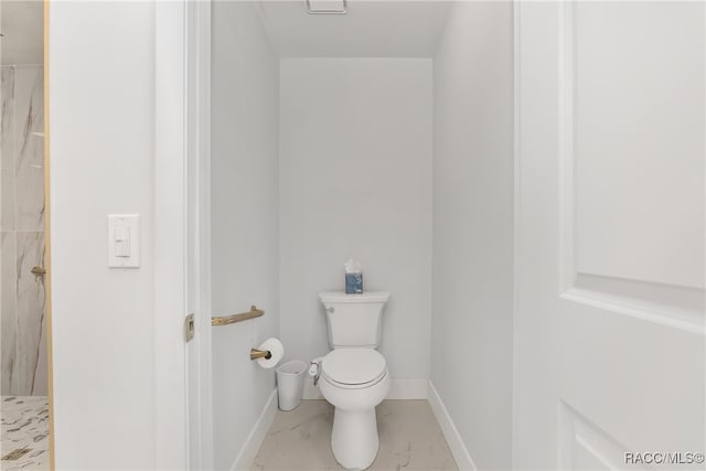 bathroom featuring toilet and a shower