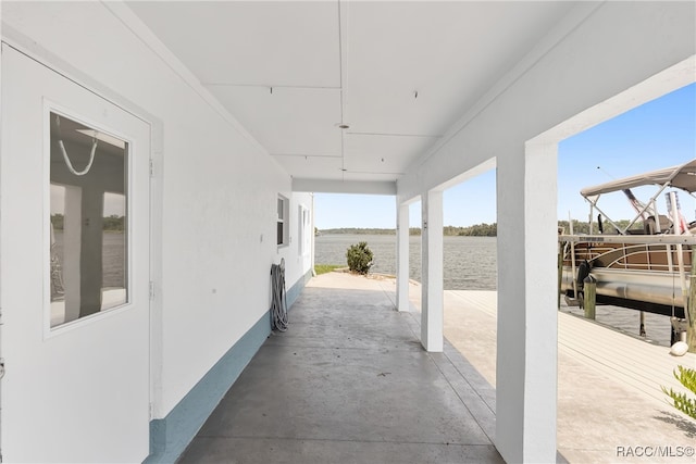 view of patio with a water view