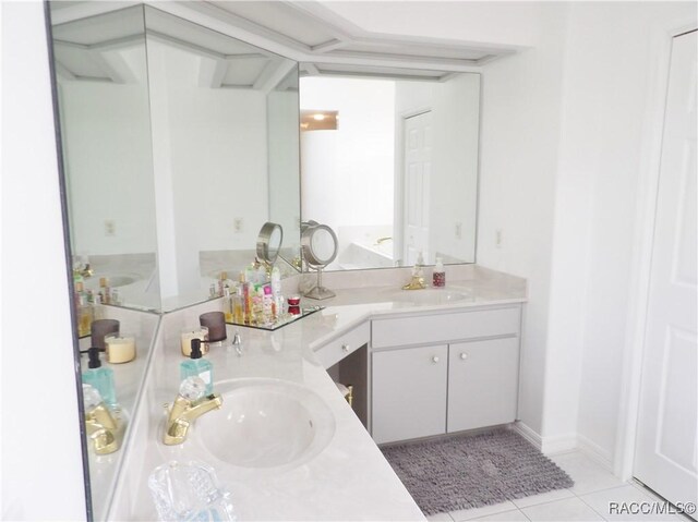 full bath featuring double vanity, tile patterned floors, and a sink