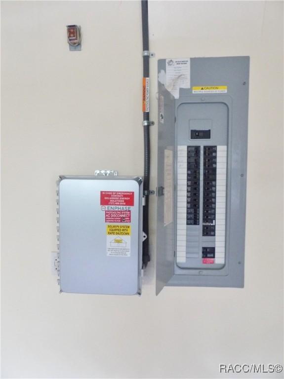 utility room featuring electric panel