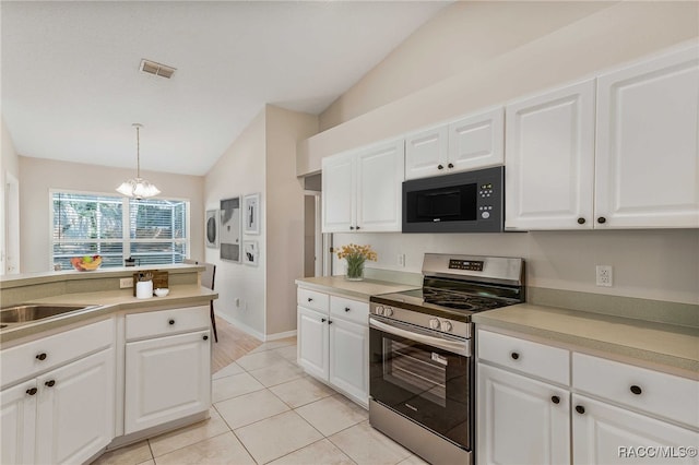 1286 N Timucuan Trl, Inverness, FL 34453 - kitchen featuring black microwave, stainless steel range, lofted ceiling, a chandelier, and light countertops