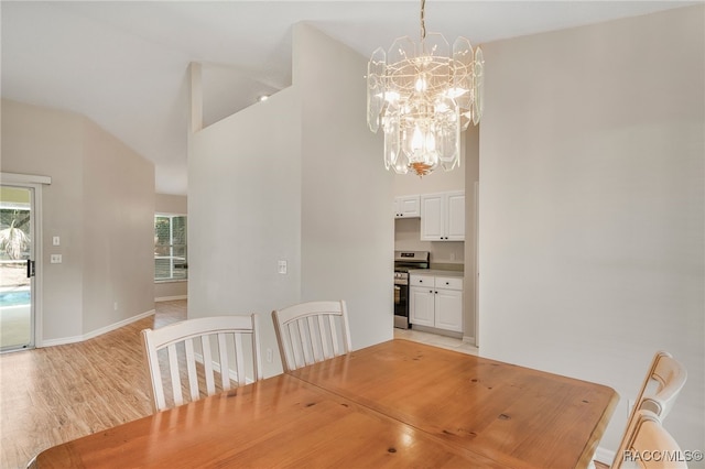 1286 N Timucuan Trl, Inverness, FL 34453 - dining room with a chandelier, high vaulted ceiling, and light wood-type flooring