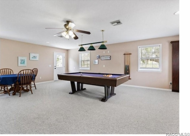 recreation room featuring billiards, ceiling fan, light colored carpet, and a healthy amount of sunlight