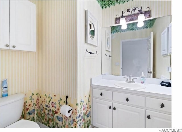 bathroom with vanity and toilet