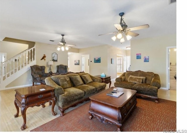 living room with hardwood / wood-style flooring and ceiling fan