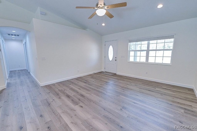 foyer entrance featuring vaulted ceiling, ceiling fan, and light hardwood / wood-style floors