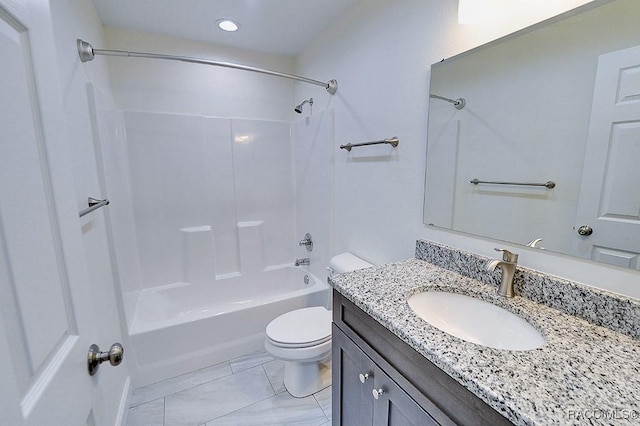 full bathroom with bathtub / shower combination, vanity, and toilet