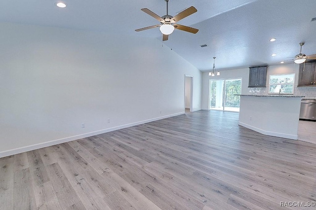 unfurnished living room featuring ceiling fan, lofted ceiling, sink, and light wood-type flooring