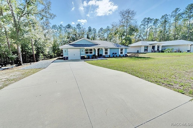 ranch-style home featuring a garage and a front yard