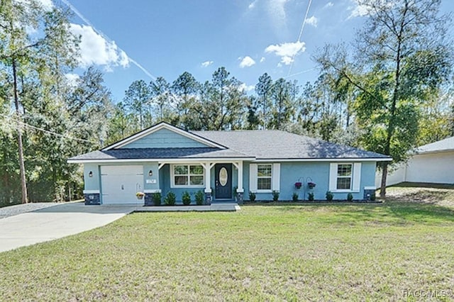 single story home featuring a garage and a front yard