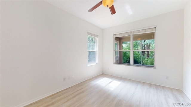 1553 E Pacific Ln, Inverness, FL 34453 - unfurnished room featuring light wood-style flooring, a ceiling fan, and baseboards
