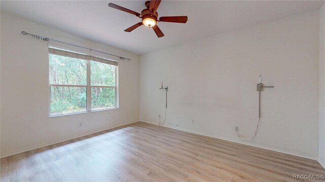 1553 E Pacific Ln, Inverness, FL 34453 - unfurnished room featuring light wood-style floors, ceiling fan, and baseboards