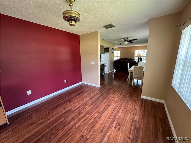 2510 W Dolphin Dr, Citrus Springs, FL 34434 - unfurnished room featuring wood finished floors, a ceiling fan, and a textured ceiling