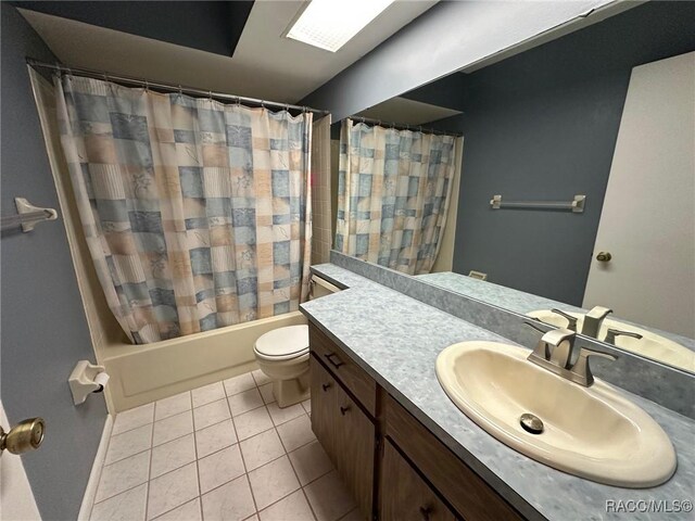2510 W Dolphin Dr, Citrus Springs, FL 34434 - bathroom featuring vanity, tile patterned flooring, and shower / bath combo with shower curtain