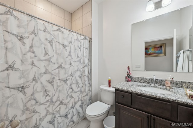 bathroom with a shower with curtain, vanity, and toilet