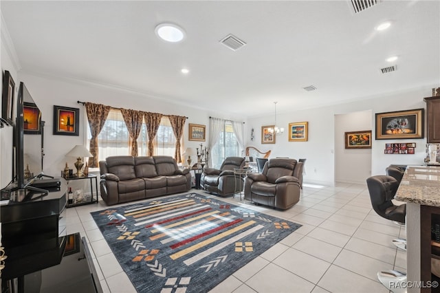 living room with light tile patterned floors, crown molding, and an inviting chandelier