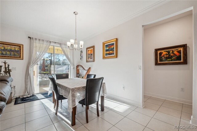 tiled dining space with crown molding and an inviting chandelier