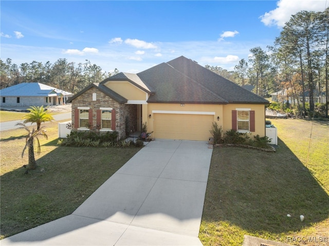 view of front of property with a garage and a front lawn