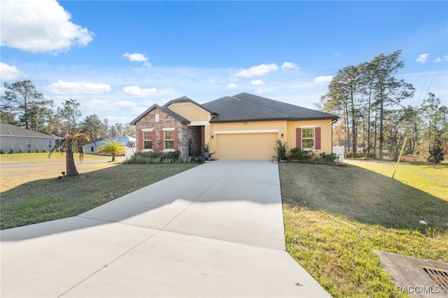 view of front of house featuring a front lawn and a garage