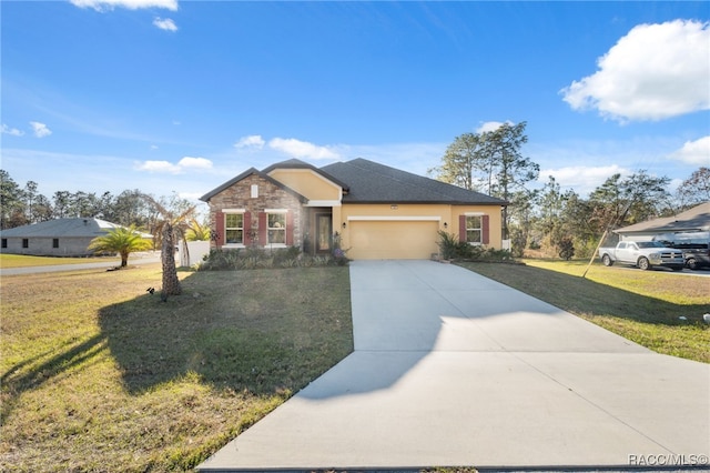 view of front of property with a front yard and a garage