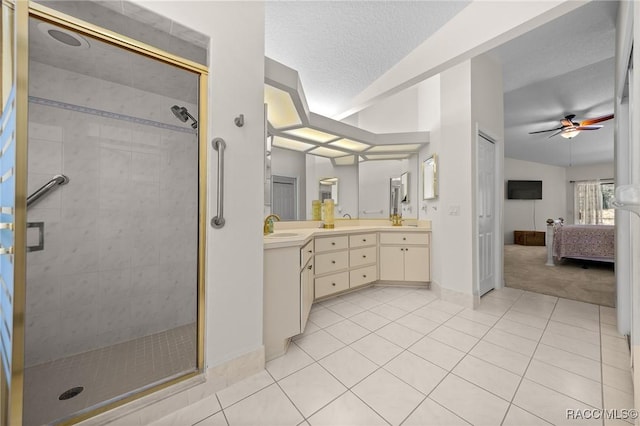 bathroom featuring tile patterned floors, a sink, connected bathroom, a stall shower, and ceiling fan