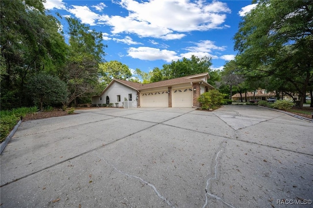 view of front of property featuring driveway and a garage