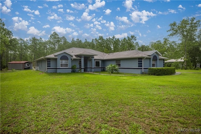 11271 SE 136th Ter, Dunnellon, FL 34431 - ranch-style house with a front lawn and stucco siding