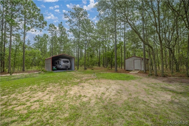 11271 SE 136th Ter, Dunnellon, FL 34431 - view of yard with a storage shed and a detached carport