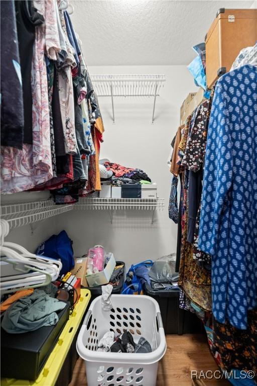 11271 SE 136th Ter, Dunnellon, FL 34431 - walk in closet featuring wood finished floors