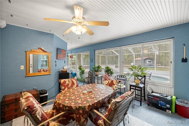 11271 SE 136th Ter, Dunnellon, FL 34431 - dining room featuring a textured wall, healthy amount of natural light, carpet, and a ceiling fan