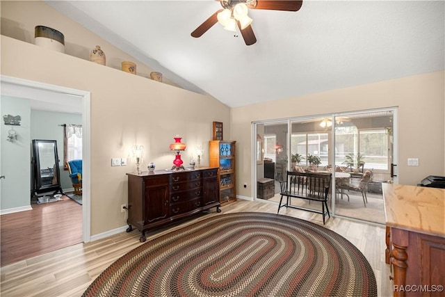 11271 SE 136th Ter, Dunnellon, FL 34431 - bedroom with light wood finished floors, lofted ceiling, access to exterior, and ceiling fan
