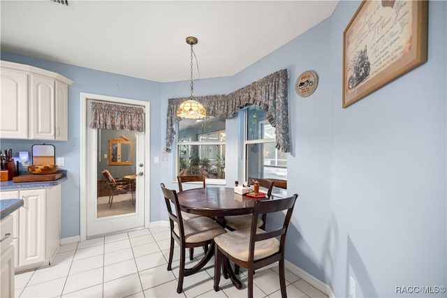 11271 SE 136th Ter, Dunnellon, FL 34431 - dining space featuring light tile patterned flooring