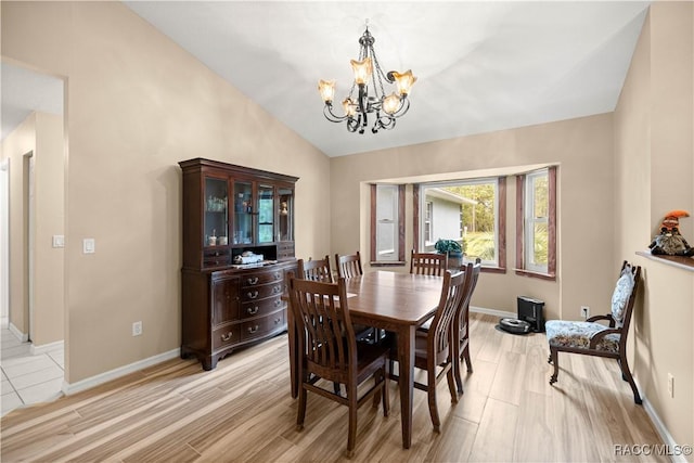 11271 SE 136th Ter, Dunnellon, FL 34431 - dining room featuring a chandelier, vaulted ceiling, and light wood finished floors
