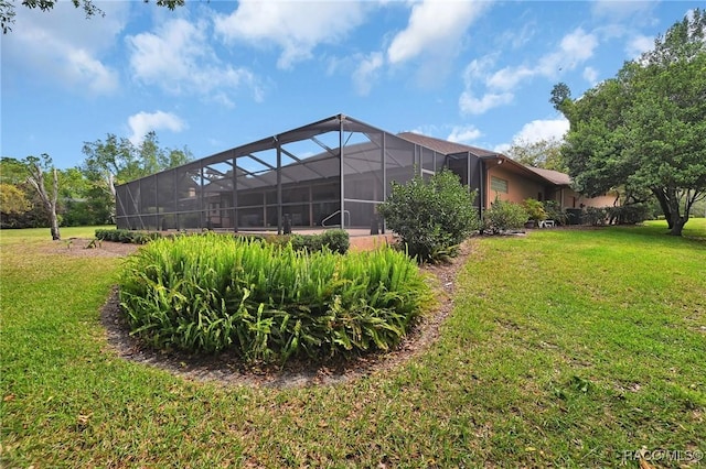 view of yard featuring glass enclosure