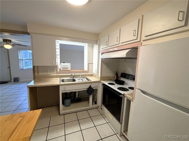 kitchen featuring tasteful backsplash, white appliances, sink, white cabinetry, and light tile patterned flooring