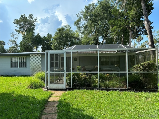 back of property featuring glass enclosure