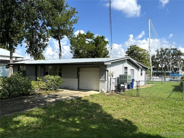 exterior space with a lawn and a garage