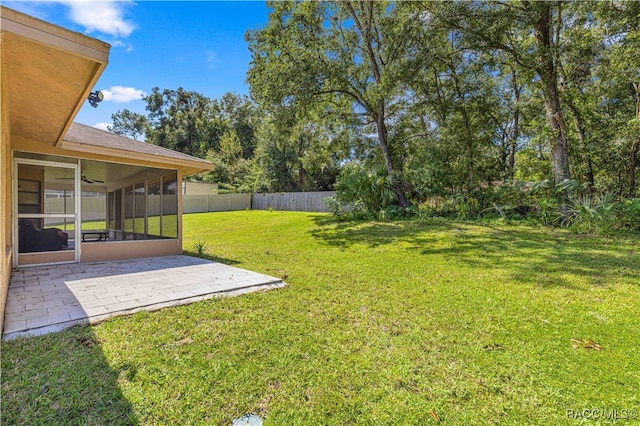 view of yard with a patio and a sunroom