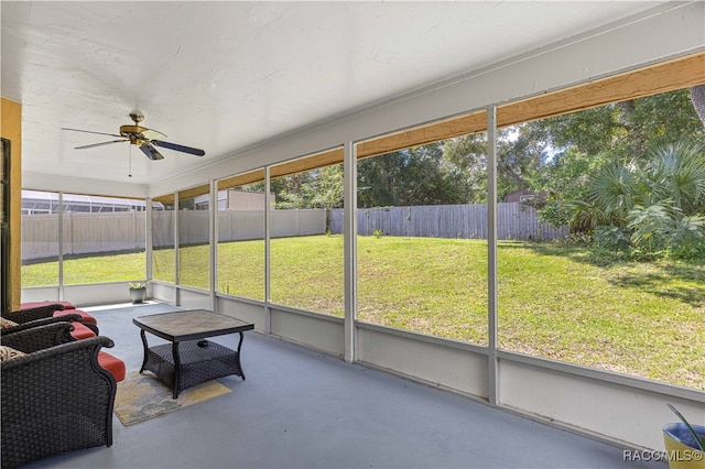 sunroom / solarium with ceiling fan and plenty of natural light